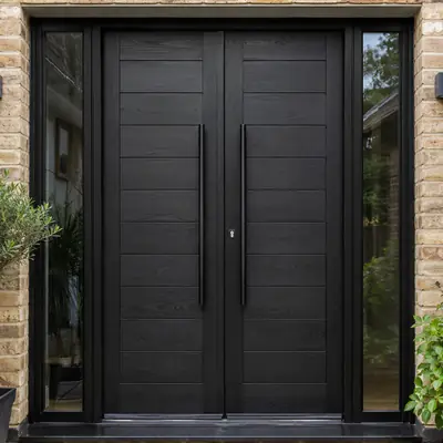 Contemporary black double timber entrance doors with full-height glazed sidelights